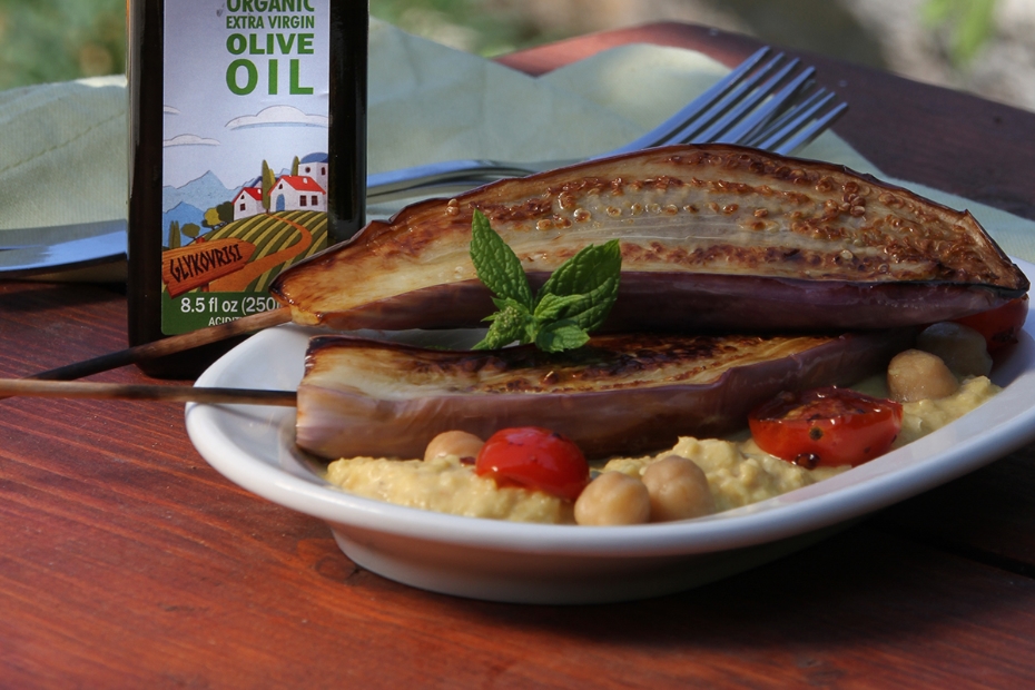 Grilled eggplant marinated in olive oil and balsamic served over hummus.