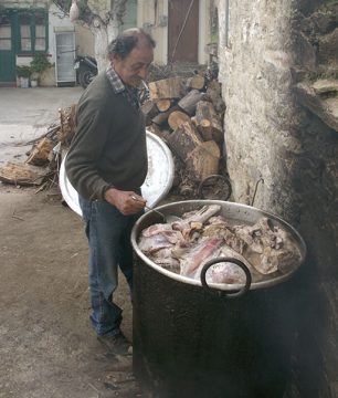 Making the Vrasto, or boiled goat, for the communal feast in our village on Ikaria.
