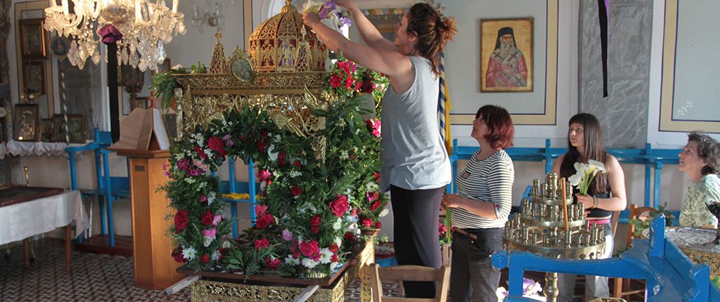 Decorating the Epitaphio on Good Friday in our village on Ikaria.