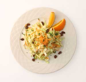 Cabbage salad is a winter dish, dressed with olive oil, lemon juice, and carrots.