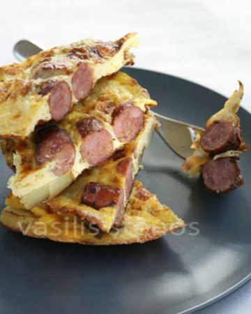 A sausage omelet specialty of the Cyclades islands Andros and Tinos, Mediterranean Diet and Greek cooking recipes..