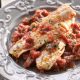 Salt Cod in light tomato sauce with spices and raisins.