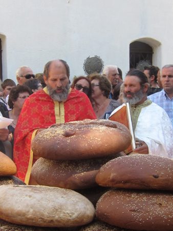 Blessing the holy bread, artos, at the Greek Monastery of Mounde on Ikaria on August 15th, the Dormition.