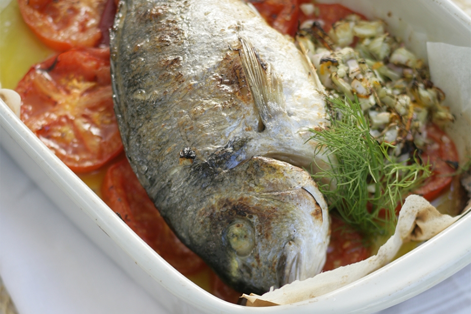 Tsipoura, or gilthead bream, roasted with tomatoes, fennel and ouzo