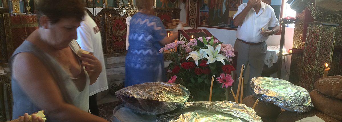 Cakes and Artos laid out at the altar on St. Fanourios Day, Aug. 27th, Ikaria. 