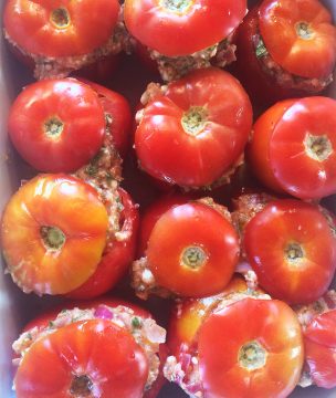 Trahana stuffed tomatoes ready for baking.