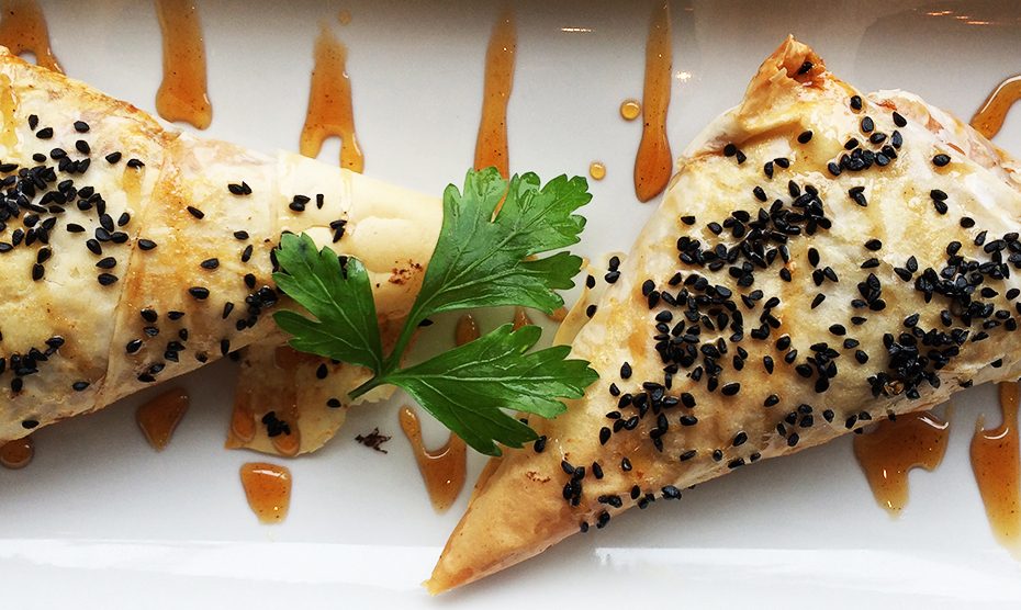 Phyllo triangles with sweet potatoes, feta and onions.