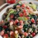 Pomegranate arils grace this black eyed pea spinach salad