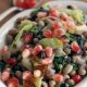 Pomegranate arils grace this black eyed pea spinach salad