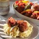 Greek meatballs cooked in tomato-pepper stew