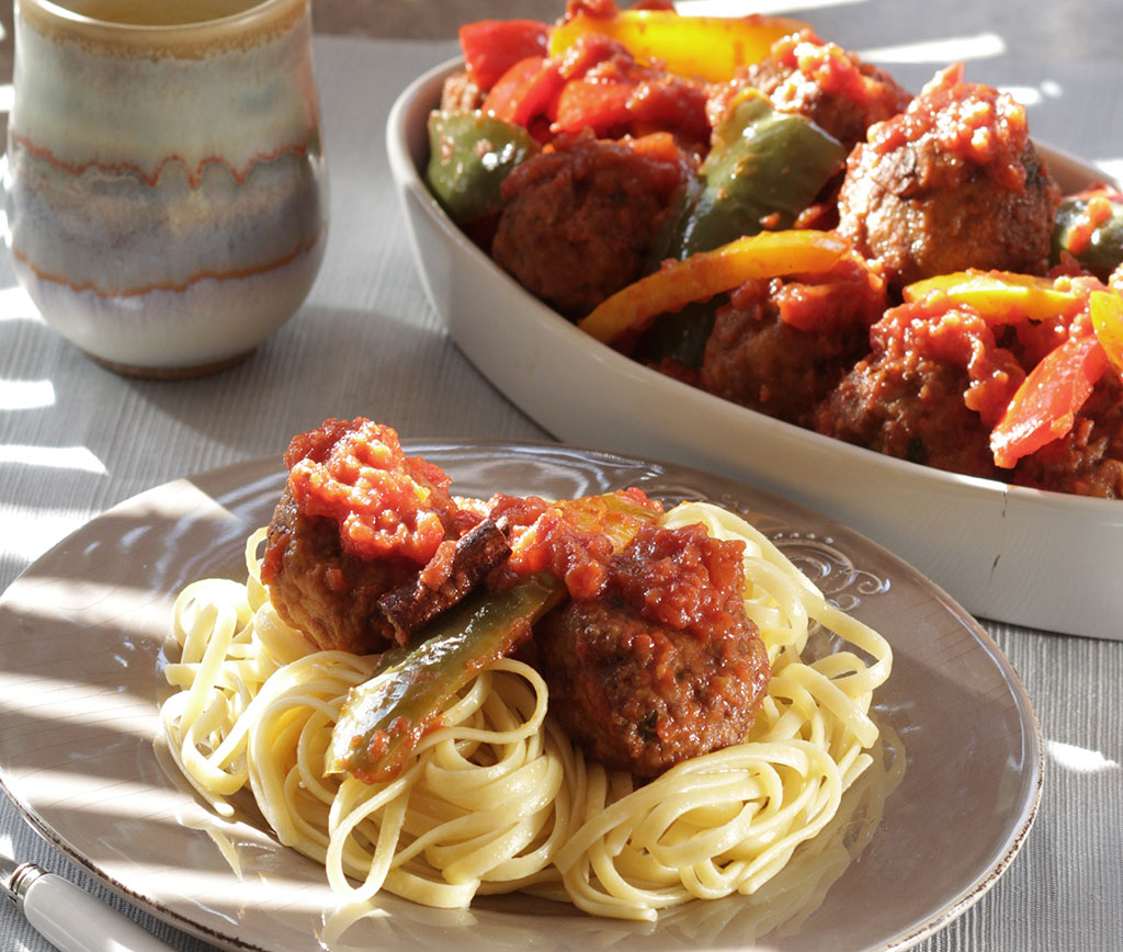 Greek meatballs cooked in tomato-pepper stew