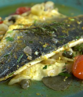 Greek Sea Bass Baked with Santorini Assyrtico Wine, Capers Leaves, and Herbs