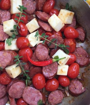 Ouzo-Seared Sausages with Tomatoes and Halloumi