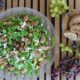 Greek Salad with Rusks, Roasted Grapes, Aegina Pistachios & Arugula