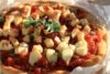 Deep-dish Santorini Pizza - Fava Crust, Santorini Tomatoes, Halloumi & Herbs