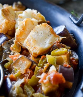 Fresh Cod Fillets Stewed with Eggplants, Peppers and Wine