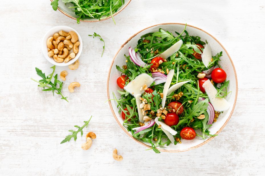 Greek salad with arugula, nuts, and extra virgin Greek olive oil