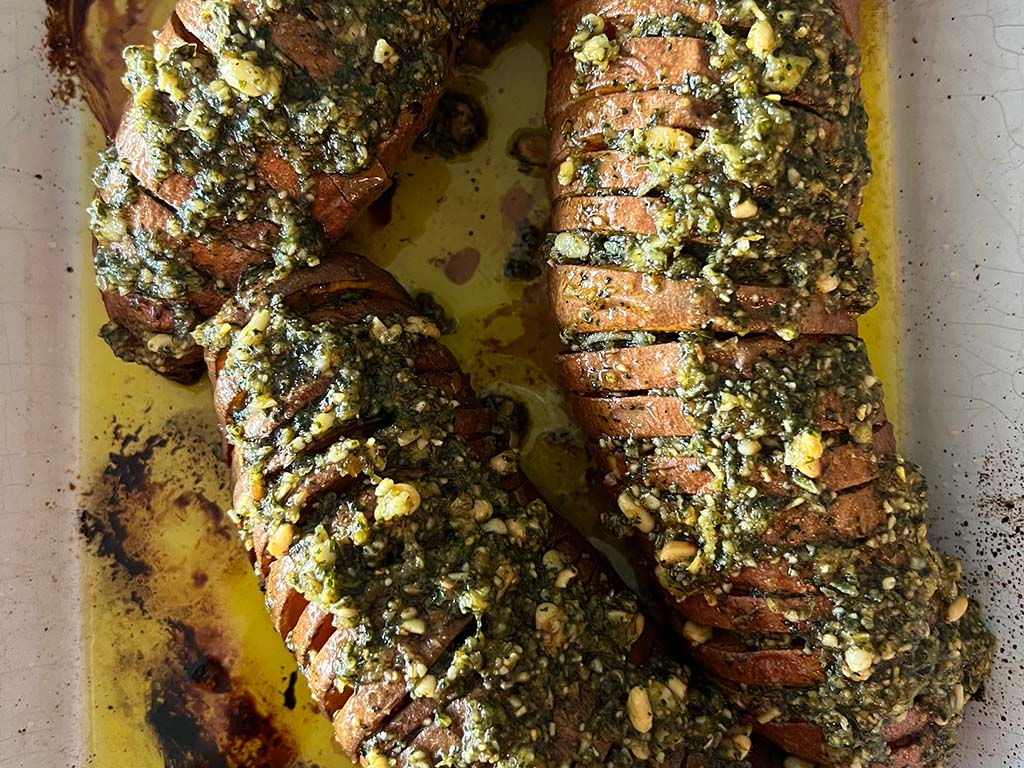 Vegan Hasselback Sweet Potatoes with Mint-Sage Pesto