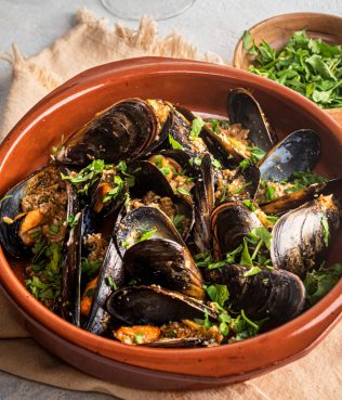 Spicy Steamed Mussels Filled With Nuts, Onions And Herbs