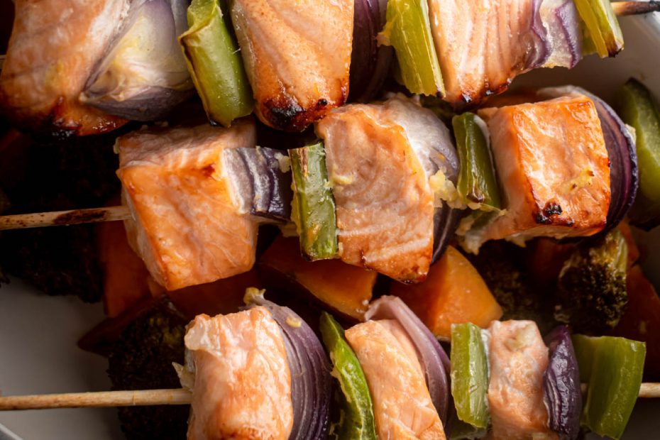 Salmon with roasted sweet potatoes and broccoli. A recipe by Diane Kochilas.