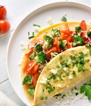 OMELET PACKED WITH TOMATOES, BROCCOLI & PEPPERS