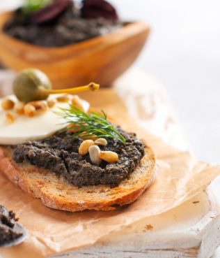 Bruschetta with Tapenade, Capers, Pine Nuts & Mozzarella