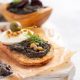 Bruschetta with Tapenade, Capers, Pine Nuts & Mozzarella