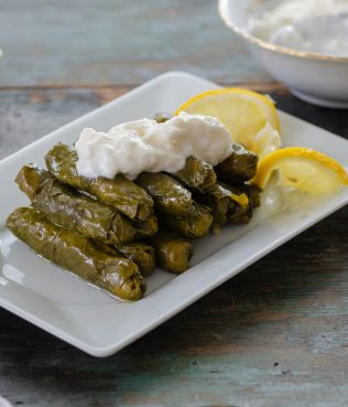 Dolmades - Grape Leaves stuffed with Rice, Onions, and Herbs