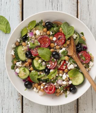 QUINOA VEGETABLE SALAD WITH ONIONS, TOMATOES, CUCUMBER, KALAMATA OLIVES, MINT, AND COTTAGE CHEESE