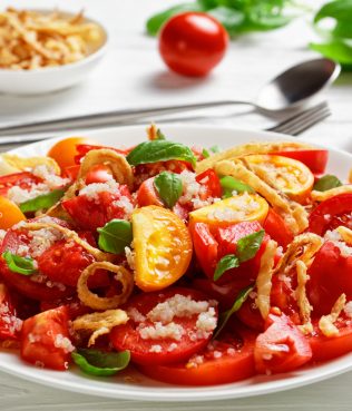 RIPE TOMATO SALAD WITH QUINOA, CRISPY ONIONS AND BASIL