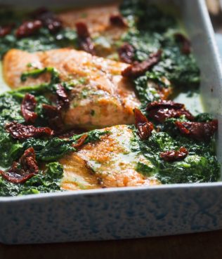 Baked Mediterranean Style Salmon with Greens and Sun-Dried Tomatoes