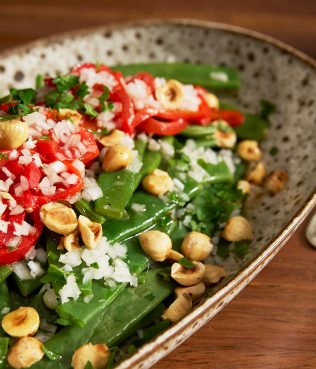 Warm Green Bean Salad With Chopped Onion And Hazelnuts