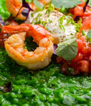 Green risotto with shrimp, caramelized tomatoes, and yogurt cheese