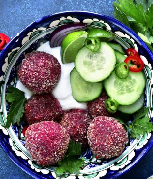 Spicy Chickpea Beetroot Falafel Garnished With Cucumbers And Yogurt