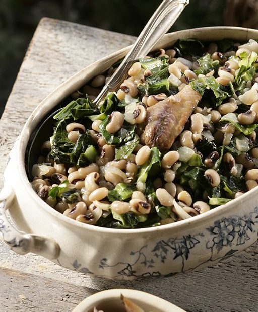Healthy recipe for black-eyed peas with collards or kale and herring. A nutritious recipe high in protein and fiber. By Diane Kochilas.