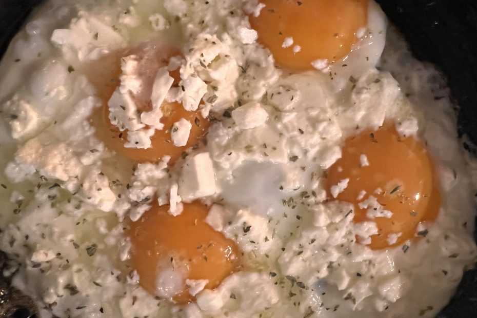 Sunny Side up eggs with Feta cheese on top, cooked in extra virgin olive oil. A recipe by Diane Kochilas.