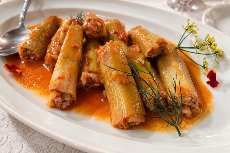 Traditional northern Greek fysékia: leek cylinders stuffed with ground beef and rice, simmered in tomato and olive oil.