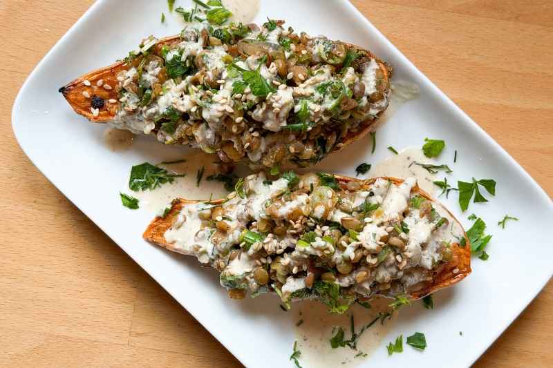 Roasted sweet potatoes with herbed lentils and lemony tahini sauce
